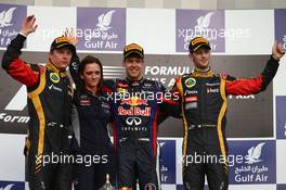 1st place for Sebastian Vettel (GER) Red Bull Racing, 2nd place Kimi Raikkonen (FIN) Lotus F1 Team and 3rd place Romain Grosjean (FRA) Lotus F1 Team with Gill Jones.  21.04.2013. Formula 1 World Championship, Rd 4, Bahrain Grand Prix, Sakhir, Bahrain, Race Day