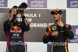 Sebastian Vettel (GER) Red Bull Racing and Romain Grosjean (FRA) Lotus F1 E21  21.04.2013. Formula 1 World Championship, Rd 4, Bahrain Grand Prix, Sakhir, Bahrain, Race Day