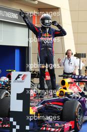 Race winner Sebastian Vettel (GER) Red Bull Racing RB9 celebrates in parc ferme. 21.04.2013. Formula 1 World Championship, Rd 4, Bahrain Grand Prix, Sakhir, Bahrain, Race Day