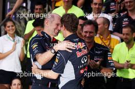 Race winner Sebastian Vettel (GER) Red Bull Racing celebrates with Adrian Newey (GBR) Red Bull Racing Chief Technical Officer and the team. 21.04.2013. Formula 1 World Championship, Rd 4, Bahrain Grand Prix, Sakhir, Bahrain, Race Day