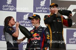 1st place for Sebastian Vettel (GER) Red Bull Racing with Gill Jones, Red Bull Racing and 2nd place Kimi Raikkonen (FIN) Lotus F1 Team  21.04.2013. Formula 1 World Championship, Rd 4, Bahrain Grand Prix, Sakhir, Bahrain, Race Day