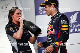 Race winner Sebastian Vettel (GER) Red Bull Racing celebrates with Gill Jones (GBR) Red Bull Racing Electronics on the podium. 21.04.2013. Formula 1 World Championship, Rd 4, Bahrain Grand Prix, Sakhir, Bahrain, Race Day