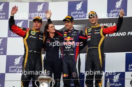 The podium (L to R): Kimi Raikkonen (FIN) Lotus F1 Team, second; Gill Jones (GBR) Red Bull Racing Electronics; Sebastian Vettel (GER) Red Bull Racing, race winner; Romain Grosjean (FRA) Lotus F1 Team, third. 21.04.2013. Formula 1 World Championship, Rd 4, Bahrain Grand Prix, Sakhir, Bahrain, Race Day