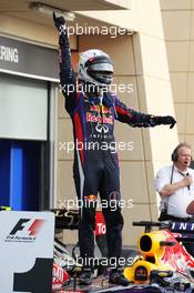 Race winner Sebastian Vettel (GER) Red Bull Racing RB9 celebrates in parc ferme. 21.04.2013. Formula 1 World Championship, Rd 4, Bahrain Grand Prix, Sakhir, Bahrain, Race Day