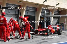 Fernando Alonso (ESP) Ferrari F138 makes a pit stop with his rear wing DRS flap stuck open. 21.04.2013. Formula 1 World Championship, Rd 4, Bahrain Grand Prix, Sakhir, Bahrain, Race Day