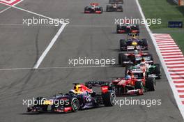 Sebastian Vettel (GER) Red Bull Racing RB9 leads Fernando Alonso (ESP) Ferrari F138. 21.04.2013. Formula 1 World Championship, Rd 4, Bahrain Grand Prix, Sakhir, Bahrain, Race Day