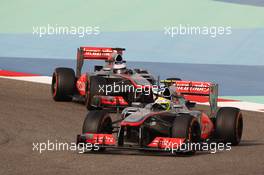 Sergio Perez (MEX) McLaren MP4-28 leads team mate Jenson Button (GBR) McLaren MP4-28. 21.04.2013. Formula 1 World Championship, Rd 4, Bahrain Grand Prix, Sakhir, Bahrain, Race Day