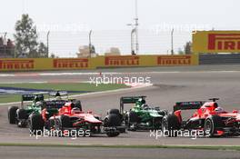 Max Chilton (GBR) Marussia F1 Team MR02 and Jules Bianchi (FRA) Marussia F1 Team MR02 at the start of the race. 21.04.2013. Formula 1 World Championship, Rd 4, Bahrain Grand Prix, Sakhir, Bahrain, Race Day