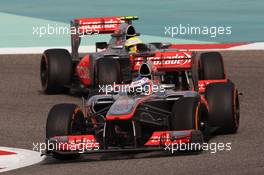 Jenson Button (GBR) McLaren MP4-28 leads Sergio Perez (MEX) McLaren MP4-28. 21.04.2013. Formula 1 World Championship, Rd 4, Bahrain Grand Prix, Sakhir, Bahrain, Race Day