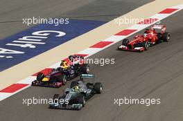 Nico Rosberg (GER) Mercedes AMG F1 W04 leads Sebastian Vettel (GER) Red Bull Racing RB9. 21.04.2013. Formula 1 World Championship, Rd 4, Bahrain Grand Prix, Sakhir, Bahrain, Race Day