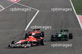 Jules Bianchi (FRA) Marussia F1 Team MR02 leads Charles Pic (FRA) Caterham CT03 and Max Chilton (GBR) Marussia F1 Team MR02. 21.04.2013. Formula 1 World Championship, Rd 4, Bahrain Grand Prix, Sakhir, Bahrain, Race Day