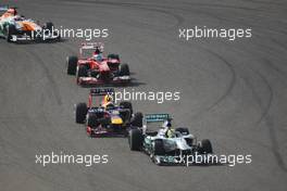 Nico Rosberg (GER) Mercedes AMG F1 W04 leads Sebastian Vettel (GER) Red Bull Racing RB9. 21.04.2013. Formula 1 World Championship, Rd 4, Bahrain Grand Prix, Sakhir, Bahrain, Race Day