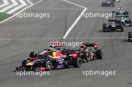 Mark Webber (AUS) Red Bull Racing RB9 leads Kimi Raikkonen (FIN) Lotus F1 E21 and Jenson Button (GBR) McLaren MP4-28. 21.04.2013. Formula 1 World Championship, Rd 4, Bahrain Grand Prix, Sakhir, Bahrain, Race Day