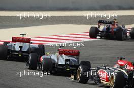Jenson Button (GBR) McLaren MP4-28 leads Sergio Perez (MEX) McLaren MP4-28 and Kimi Raikkonen (FIN) Lotus F1 E21. 21.04.2013. Formula 1 World Championship, Rd 4, Bahrain Grand Prix, Sakhir, Bahrain, Race Day