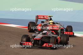 Jenson Button (GBR) McLaren MP4-28 leads Sergio Perez (MEX) McLaren MP4-28. 21.04.2013. Formula 1 World Championship, Rd 4, Bahrain Grand Prix, Sakhir, Bahrain, Race Day