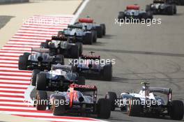 Jean-Eric Vergne (FRA) Scuderia Toro Rosso STR8 and Valtteri Bottas (FIN) Williams FW35 at the start of the race. 21.04.2013. Formula 1 World Championship, Rd 4, Bahrain Grand Prix, Sakhir, Bahrain, Race Day