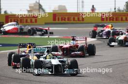 Nico Rosberg (GER) Mercedes AMG F1 W04 leads Sebastian Vettel (GER) Red Bull Racing RB9 and Fernando Alonso (ESP) Ferrari F138. 21.04.2013. Formula 1 World Championship, Rd 4, Bahrain Grand Prix, Sakhir, Bahrain, Race Day