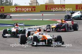 Paul di Resta (GBR) Sahara Force India VJM06 and Adrian Sutil (GER) Sahara Force India VJM06. 21.04.2013. Formula 1 World Championship, Rd 4, Bahrain Grand Prix, Sakhir, Bahrain, Race Day