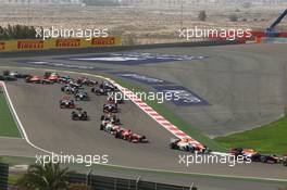 Sebastian Vettel (GER) Red Bull Racing RB9 leads Paul di Resta (GBR) Sahara Force India VJM06 at the start of the race. 21.04.2013. Formula 1 World Championship, Rd 4, Bahrain Grand Prix, Sakhir, Bahrain, Race Day