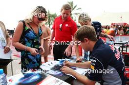 Sebastian Vettel (GER) Red Bull Racing signs autographs for the fans. 20.04.2013. Formula 1 World Championship, Rd 4, Bahrain Grand Prix, Sakhir, Bahrain, Qualifying Day