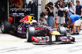 Sebastian Vettel (GER) Red Bull Racing RB9 leaves the pits. 20.04.2013. Formula 1 World Championship, Rd 4, Bahrain Grand Prix, Sakhir, Bahrain, Qualifying Day