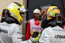 (L to R): Nico Rosberg (GER) Mercedes AMG F1 celebrates his pole position in parc ferme with team mate Lewis Hamilton (GBR) Mercedes AMG F1. 20.04.2013. Formula 1 World Championship, Rd 4, Bahrain Grand Prix, Sakhir, Bahrain, Qualifying Day