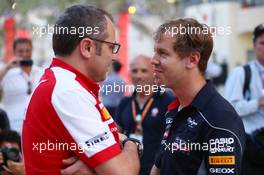 (L to R): Stefano Domenicali (ITA) Ferrari General Director talks with Sebastian Vettel (GER) Red Bull Racing. 20.04.2013. Formula 1 World Championship, Rd 4, Bahrain Grand Prix, Sakhir, Bahrain, Qualifying Day