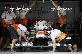 Adrian Sutil (GER) Sahara Force India VJM06 in the pits. 20.04.2013. Formula 1 World Championship, Rd 4, Bahrain Grand Prix, Sakhir, Bahrain, Qualifying Day