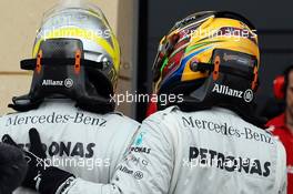 (L to R): Nico Rosberg (GER) Mercedes AMG F1 celebrates his pole position in parc ferme with team mate Lewis Hamilton (GBR) Mercedes AMG F1. 20.04.2013. Formula 1 World Championship, Rd 4, Bahrain Grand Prix, Sakhir, Bahrain, Qualifying Day