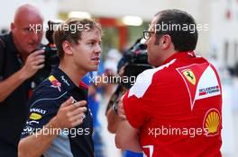 (L to R): Sebastian Vettel (GER) Red Bull Racing talks with Stefano Domenicali (ITA) Ferrari General Director. 20.04.2013. Formula 1 World Championship, Rd 4, Bahrain Grand Prix, Sakhir, Bahrain, Qualifying Day