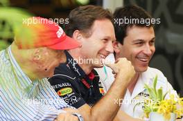 (L to R): Niki Lauda (AUT) Mercedes Non-Executive Chairman with Christian Horner (GBR) Red Bull Racing Team Principal and Toto Wolff (GER) Mercedes AMG F1 Shareholder and Executive Director. 21.04.2013. Formula 1 World Championship, Rd 4, Bahrain Grand Prix, Sakhir, Bahrain, Race Day