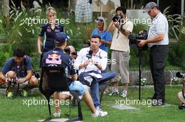 Will Buxton (GBR) NBS Sports Network TV Presenter with Sebastian Vettel (GER) Red Bull Racing. 18.04.2013. Formula 1 World Championship, Rd 4, Bahrain Grand Prix, Sakhir, Bahrain, Preparation Day