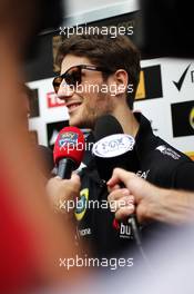 Romain Grosjean (FRA) Lotus F1 Team with the media. 18.04.2013. Formula 1 World Championship, Rd 4, Bahrain Grand Prix, Sakhir, Bahrain, Preparation Day