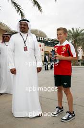 HRH Prince Salman bin Hamad Al Khalifa, Crown Prince of Bahrain with a young Ferrari fan. 18.04.2013. Formula 1 World Championship, Rd 4, Bahrain Grand Prix, Sakhir, Bahrain, Preparation Day