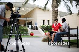 Jules Bianchi (FRA) Marussia F1 Team with Sanjeev Palar, FOX Sports / Star Sports Presenter. 18.04.2013. Formula 1 World Championship, Rd 4, Bahrain Grand Prix, Sakhir, Bahrain, Preparation Day