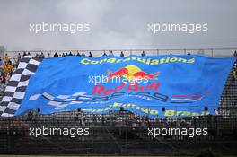 A large banner congratulates the Red Bull Racing team. 22.11.2013. Formula 1 World Championship, Rd 19, Brazilian Grand Prix, Sao Paulo, Brazil, Practice Day.