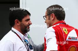 (L to R): Luis Garcia Abad (ESP) Driver Manager of Fernando Alonso (ESP) Ferrari with Stefano Domenicali (ITA) Ferrari General Director. 22.11.2013. Formula 1 World Championship, Rd 19, Brazilian Grand Prix, Sao Paulo, Brazil, Practice Day.