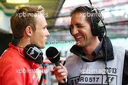 (L to R): Max Chilton (GBR) Marussia F1 Team with Tom Clarkson (GBR) Journalist and BBC TV Reporter. 22.11.2013. Formula 1 World Championship, Rd 19, Brazilian Grand Prix, Sao Paulo, Brazil, Practice Day.