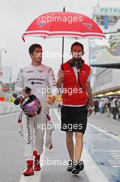 Rodolfo Gonzalez (VEN) Marussia F1 Team Reserve Driver (Left) and Sam Village (GBR) Marussia F1 Team. 22.11.2013. Formula 1 World Championship, Rd 19, Brazilian Grand Prix, Sao Paulo, Brazil, Practice Day.
