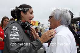 (L to R): Monisha Kaltenborn (AUT) Sauber Team Principal with Bernie Ecclestone (GBR) CEO Formula One Group (FOM) on the grid. 24.11.2013. Formula 1 World Championship, Rd 19, Brazilian Grand Prix, Sao Paulo, Brazil, Race Day.