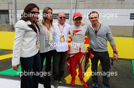 Felipe Massa (BRA) Ferrari with his family. 24.11.2013. Formula 1 World Championship, Rd 19, Brazilian Grand Prix, Sao Paulo, Brazil, Race Day.