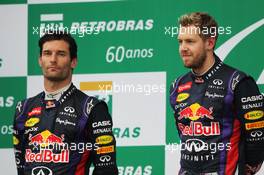The podium (L to R): second placed Mark Webber (AUS) Red Bull Racing with team mate, race winner, Sebastian Vettel (GER) Red Bull Racing. 24.11.2013. Formula 1 World Championship, Rd 19, Brazilian Grand Prix, Sao Paulo, Brazil, Race Day.