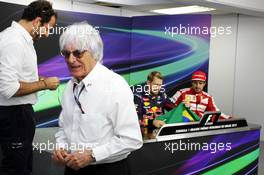 Bernie Ecclestone (GBR) CEO Formula One Group (FOM) presents a brazilian flag, signed by himself and all the drivers, for Sebastian Vettel (GER) Red Bull Racing to sign, to be presented to Mark Webber (AUS) Red Bull Racing. 24.11.2013. Formula 1 World Championship, Rd 19, Brazilian Grand Prix, Sao Paulo, Brazil, Race Day.