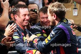Race winner Sebastian Vettel (GER) Red Bull Racing celebrates with Kenny Handkammer, Red Bull Racing Chief Mechanic in parc ferme. 24.11.2013. Formula 1 World Championship, Rd 19, Brazilian Grand Prix, Sao Paulo, Brazil, Race Day.