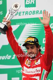 Fernando Alonso (ESP) Ferrari celebrates his third position on the podium. 24.11.2013. Formula 1 World Championship, Rd 19, Brazilian Grand Prix, Sao Paulo, Brazil, Race Day.