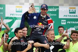 Mark Webber (AUS) Red Bull Racing celebrates his second position and final GP with the team. 24.11.2013. Formula 1 World Championship, Rd 19, Brazilian Grand Prix, Sao Paulo, Brazil, Race Day.