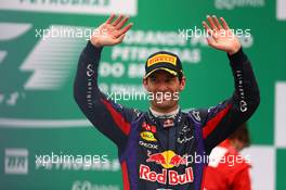 Mark Webber (AUS) Red Bull Racing celebrates his second position and last GP on the podium. 24.11.2013. Formula 1 World Championship, Rd 19, Brazilian Grand Prix, Sao Paulo, Brazil, Race Day.