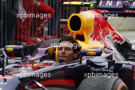 Mark Webber (AUS) Red Bull Racing RB9 arrives in parc ferme minus his helmet after finishing his last GP. 24.11.2013. Formula 1 World Championship, Rd 19, Brazilian Grand Prix, Sao Paulo, Brazil, Race Day.
