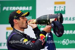 Mark Webber (AUS) Red Bull Racing celebrates his second position and final GP on the podium. 24.11.2013. Formula 1 World Championship, Rd 19, Brazilian Grand Prix, Sao Paulo, Brazil, Race Day.