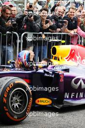 Second placed Mark Webber (AUS) Red Bull Racing RB9 arrives in parc ferme without his helmet. 24.11.2013. Formula 1 World Championship, Rd 19, Brazilian Grand Prix, Sao Paulo, Brazil, Race Day.
